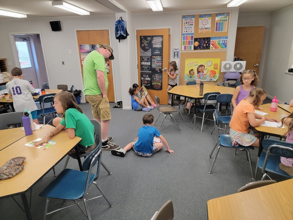 students learning in a classroom with a teacher