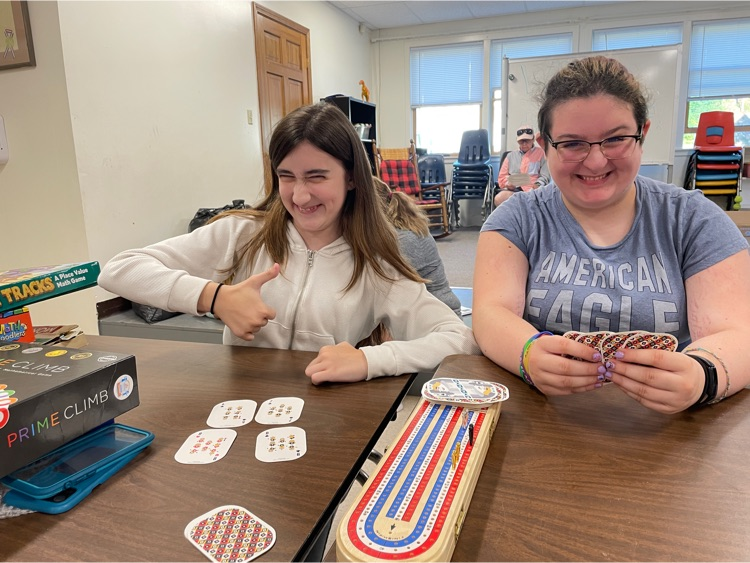 Two students brush up on the Cribbage skills