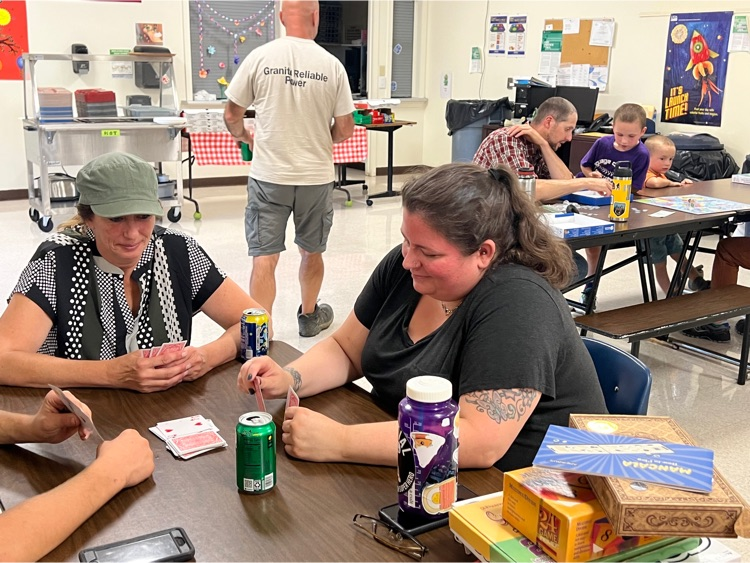 Family and friends enjoying math game night
