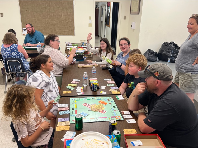 Family and friends enjoying math game night 