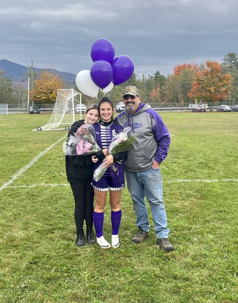 Family of 3 standing with their senior soccer player